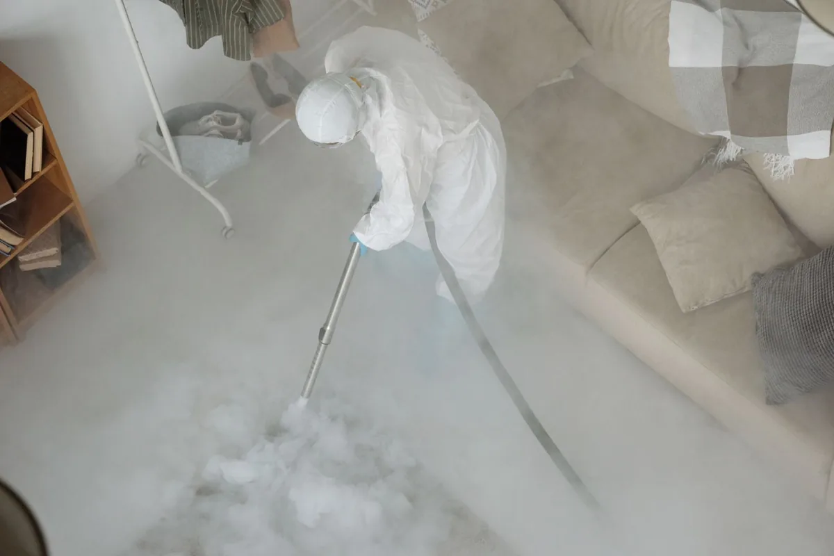 Biohazard cleanup technician in protective equipment, Shamrock, TX